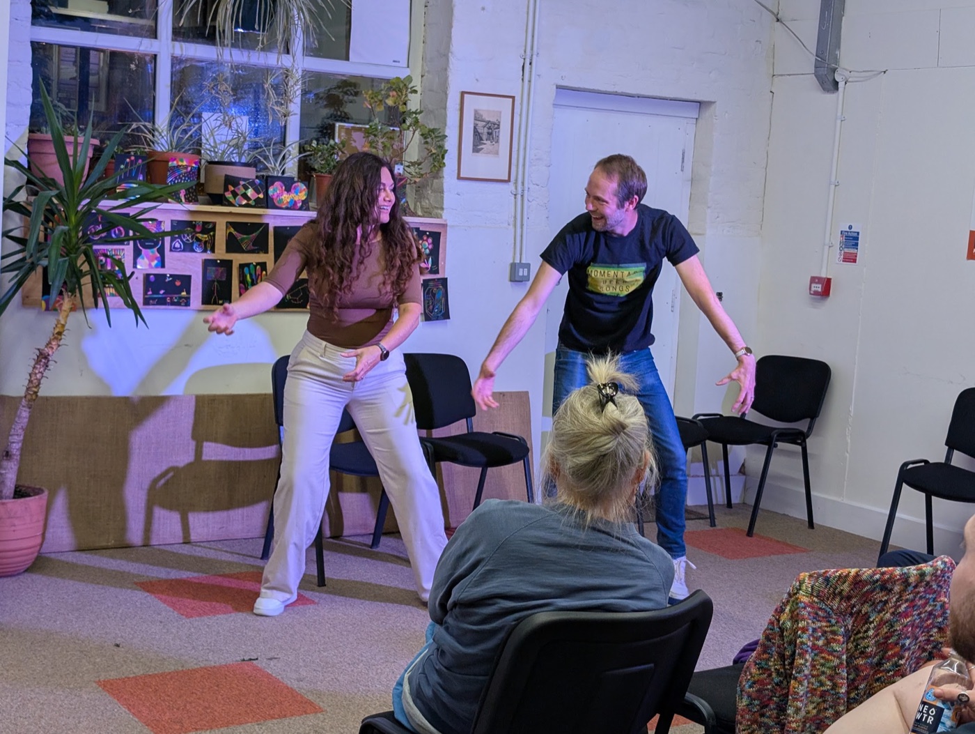 Dogface improvisers performing a scene for an audience
