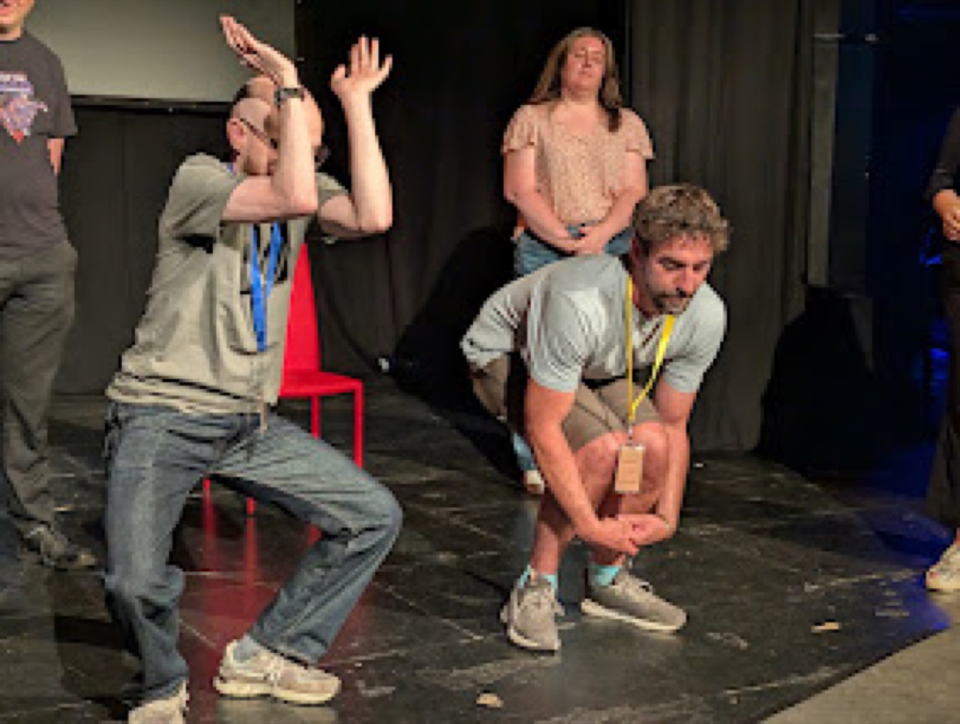 Dogface improvisers in a lively scene on stage