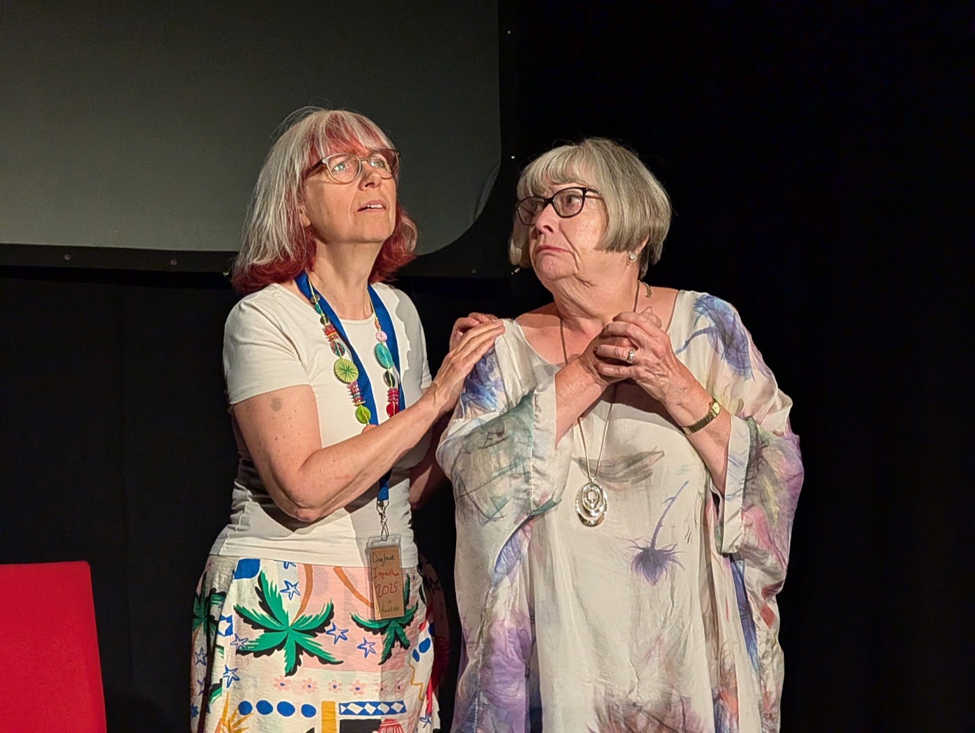 Two performers in an emotional improvised scene